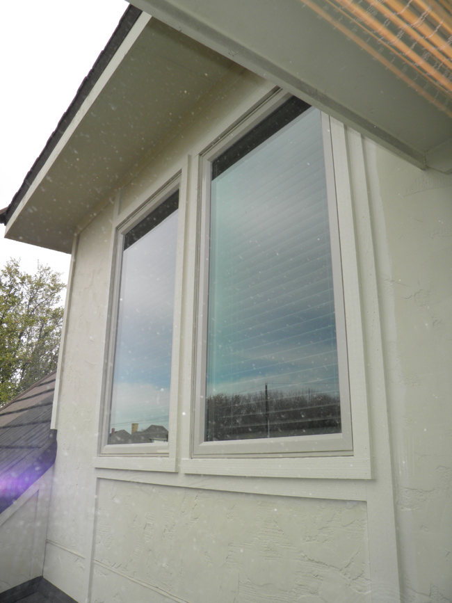 Casement Vinyl Windows provide ventilation by opening like a door with a screen on the inside.