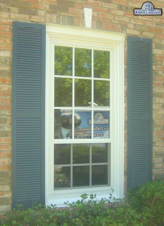 Simulated divided lite grids look great on this old wood window replacement with full trim pack over the wood on the outside